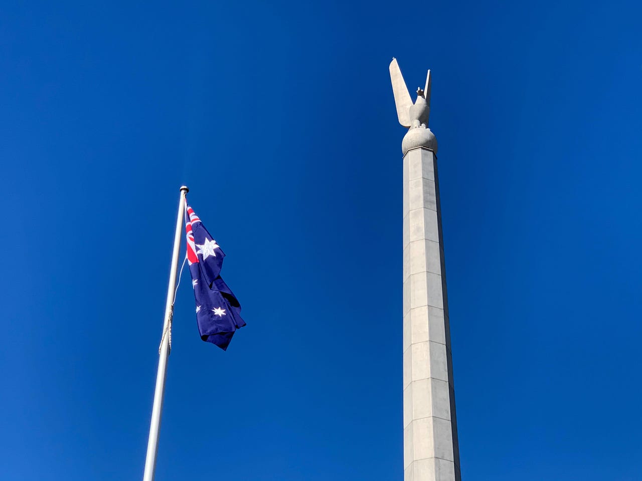 australia-australian-canberra-department-of-defence-russell-office-bird-statue-with-flag.jpg