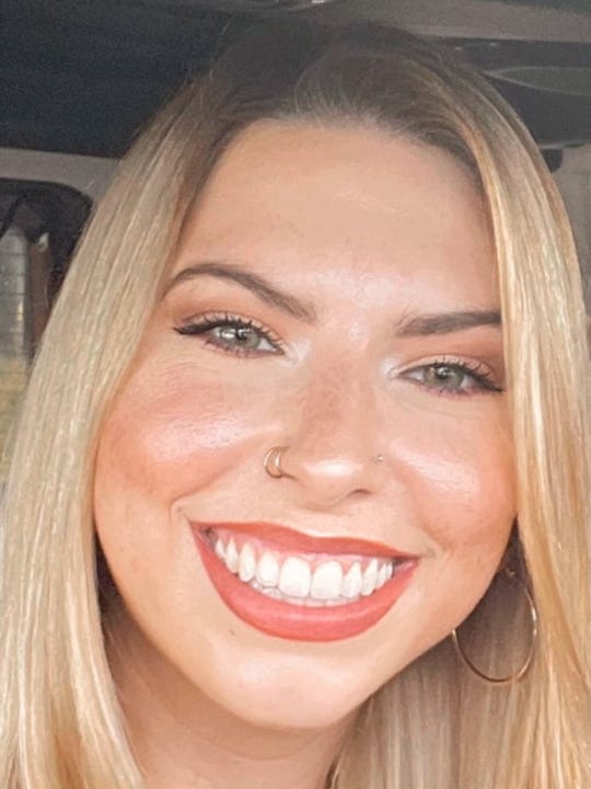 Alexandria Tapia, a blonde woman, smiles at the camera