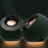 A pair of Creative Labs Pebble 2.0 speakers on a dark background