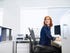 getty-woman-sitting-at-her-desk-in-an-office-and-looking-over-their-shoulder.jpg