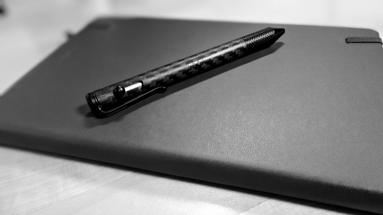 Black and white photo of diary and pen.