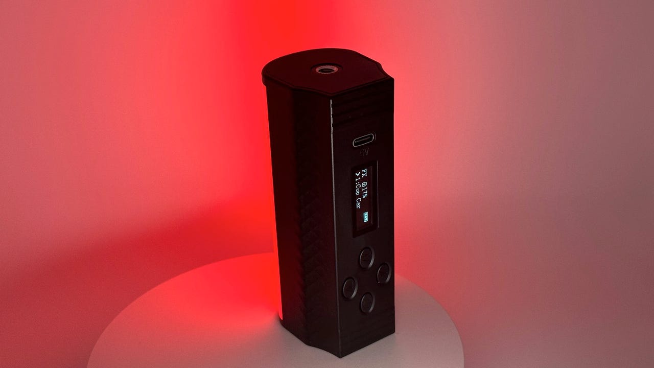 Neewer TL96RGB magnetic handheld light emitting a red light