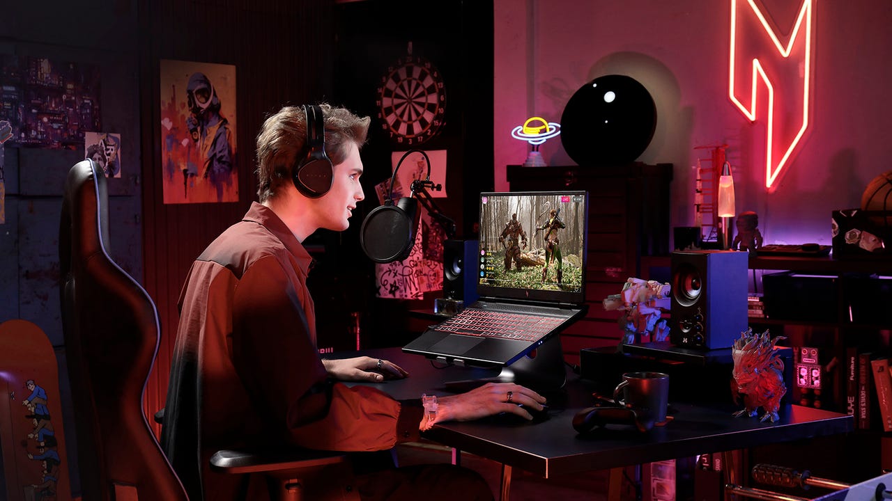 Acer's Nitro 16 Gaming laptop in a typical gamer bedroom