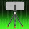 Tripod holding a smartphone against a green and black background