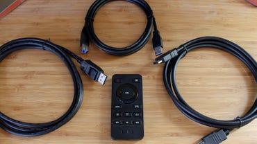 The remote and cables that come with the BenQ Mobiuz gaming monitor
