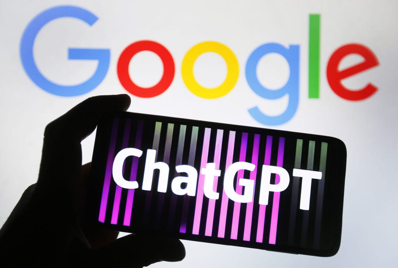 A phone showing the ChatGPT logo in front of a Google logo