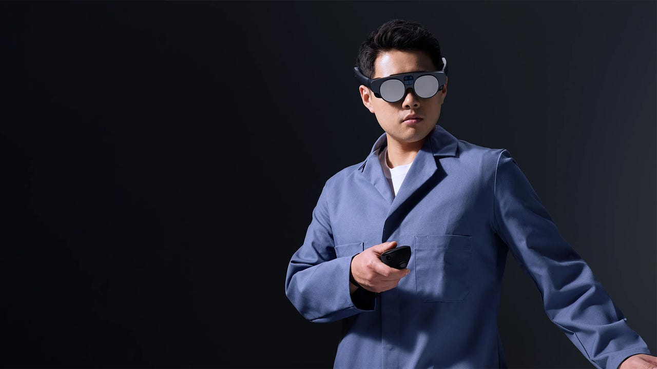 A man using the Magic Leap 2 headset and controller