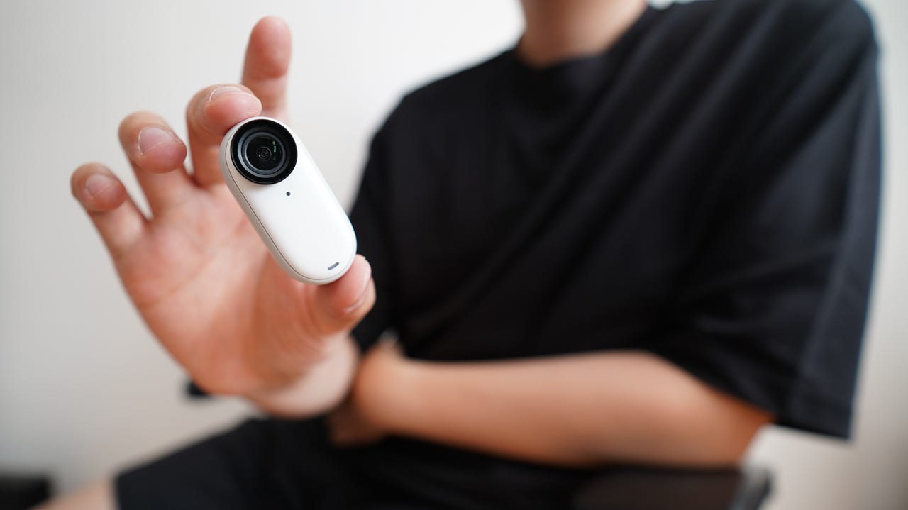 A person holding the Insta360 Go 3