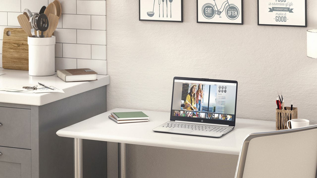 HP 15.6" Touchscreen Laptop on a desk by a kitchen