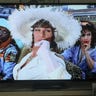 A TCL QM8 TV showing a scene from the movie To Wong Foo Thanks for Everything Julie Newmar