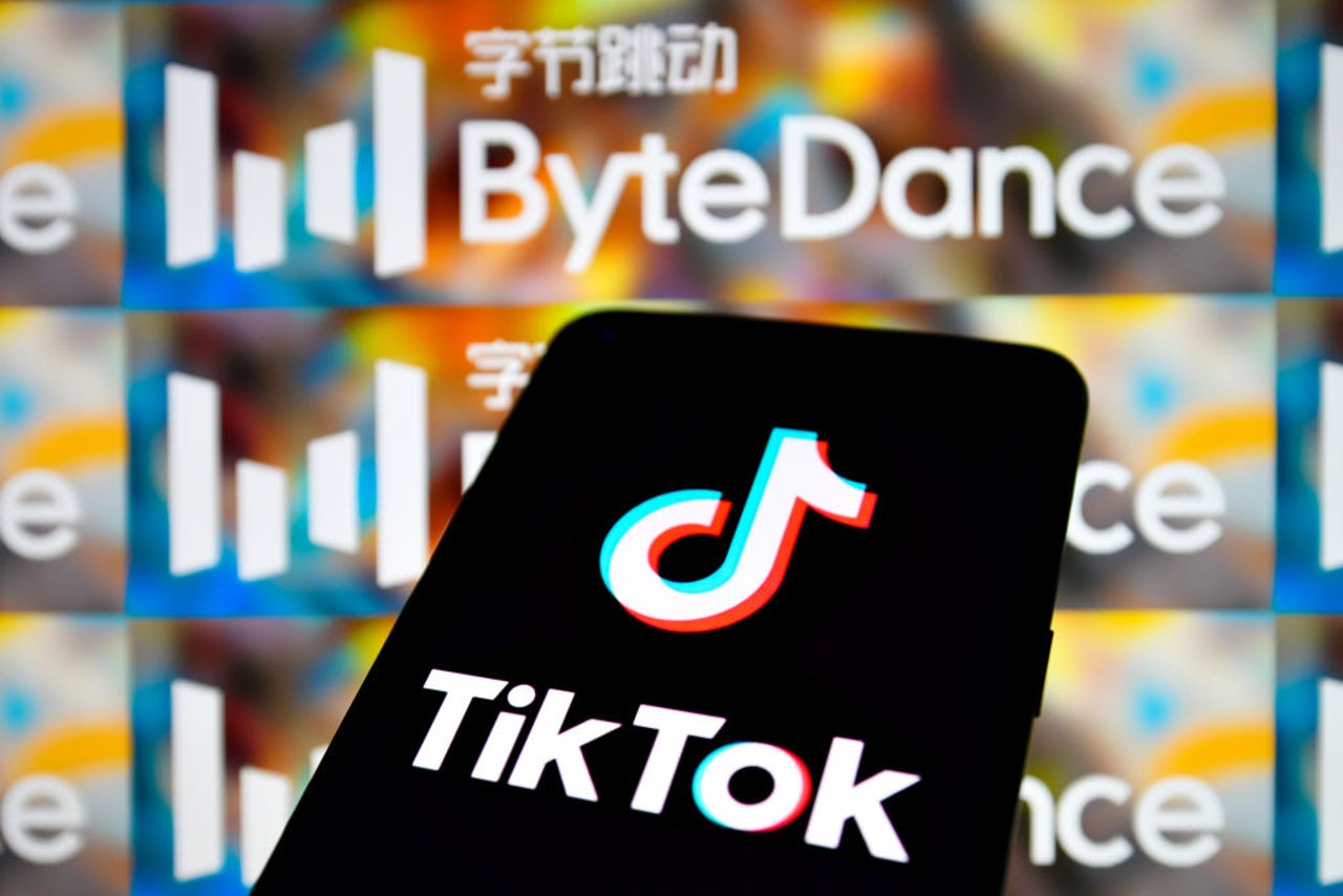 The TikTok logo on the phone in front of the background with the words ByteDance