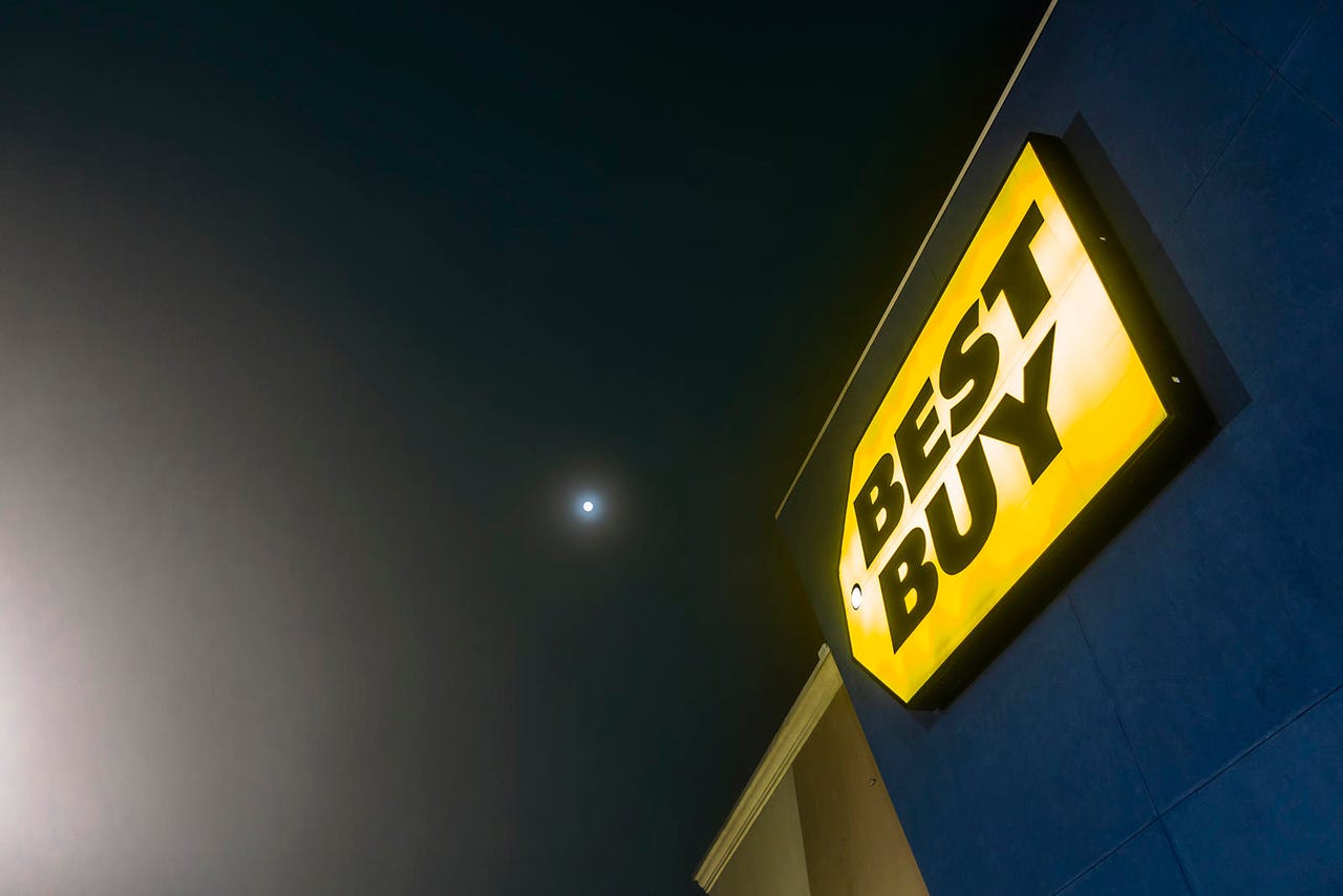 Lit up exterior sign of a local Best Buy store