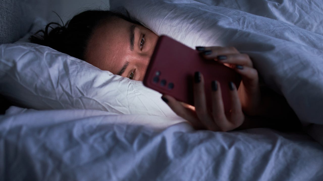 using a smartphone in bed