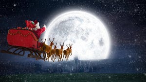 Santa Claus riding on sleigh against bright moon
