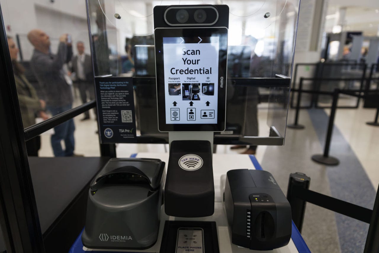 TSA check with request to "Scan Your Credential"