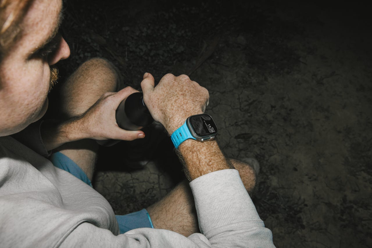 Person wearing Apple Watch band in Electric Blue