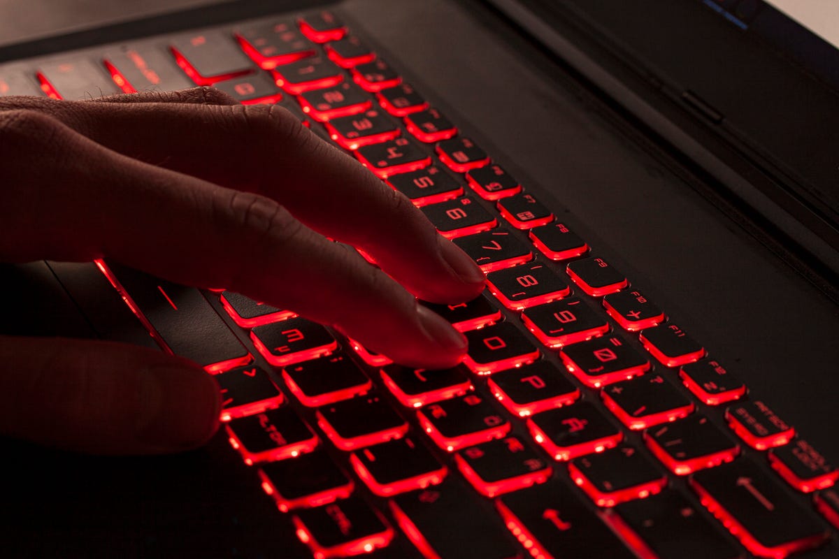 gettyimages-close-up-of-ingers-typing-on-light-Red-backlight-keys-on-a-computer-keyboard.jpg