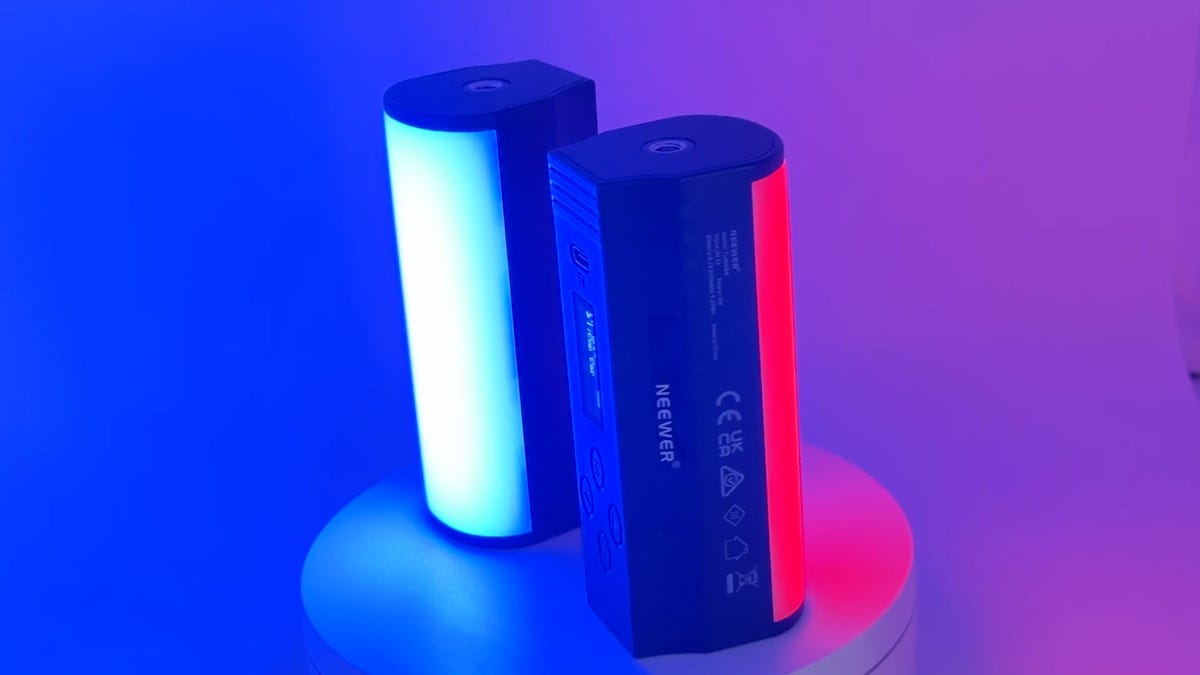 Two Neewer TL96RGB magnetic light sticks emitting red and blue light