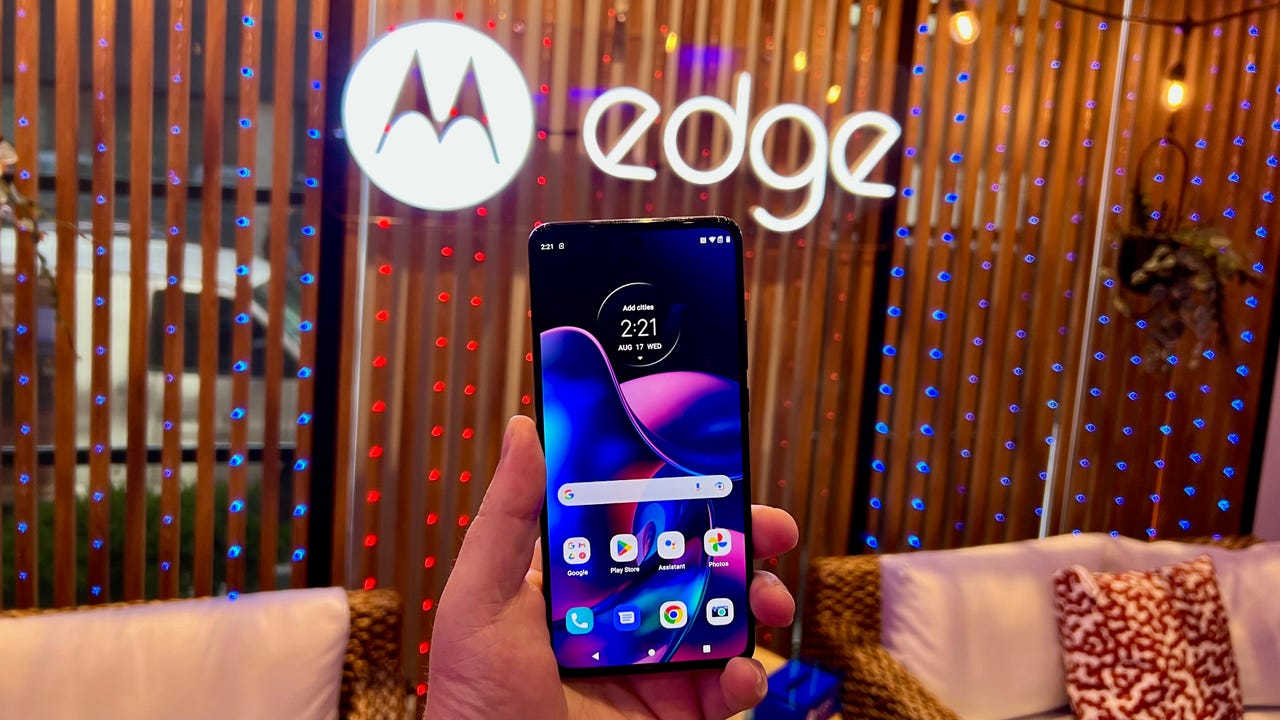 Hand holding the Motorola Edge 2022 smartphone