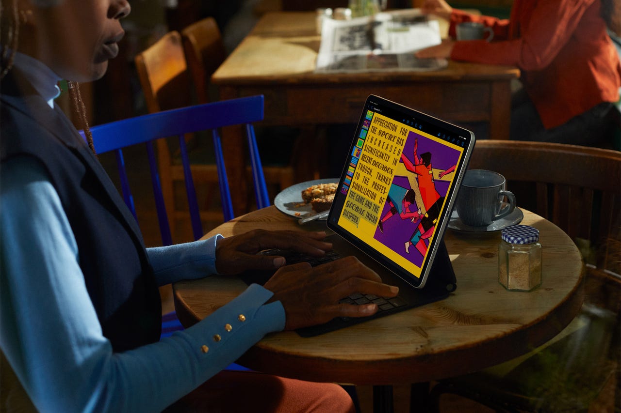 Using an iPad Pro with keyboard in a cafe.