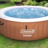 A brown inflatable hot tub on the grass