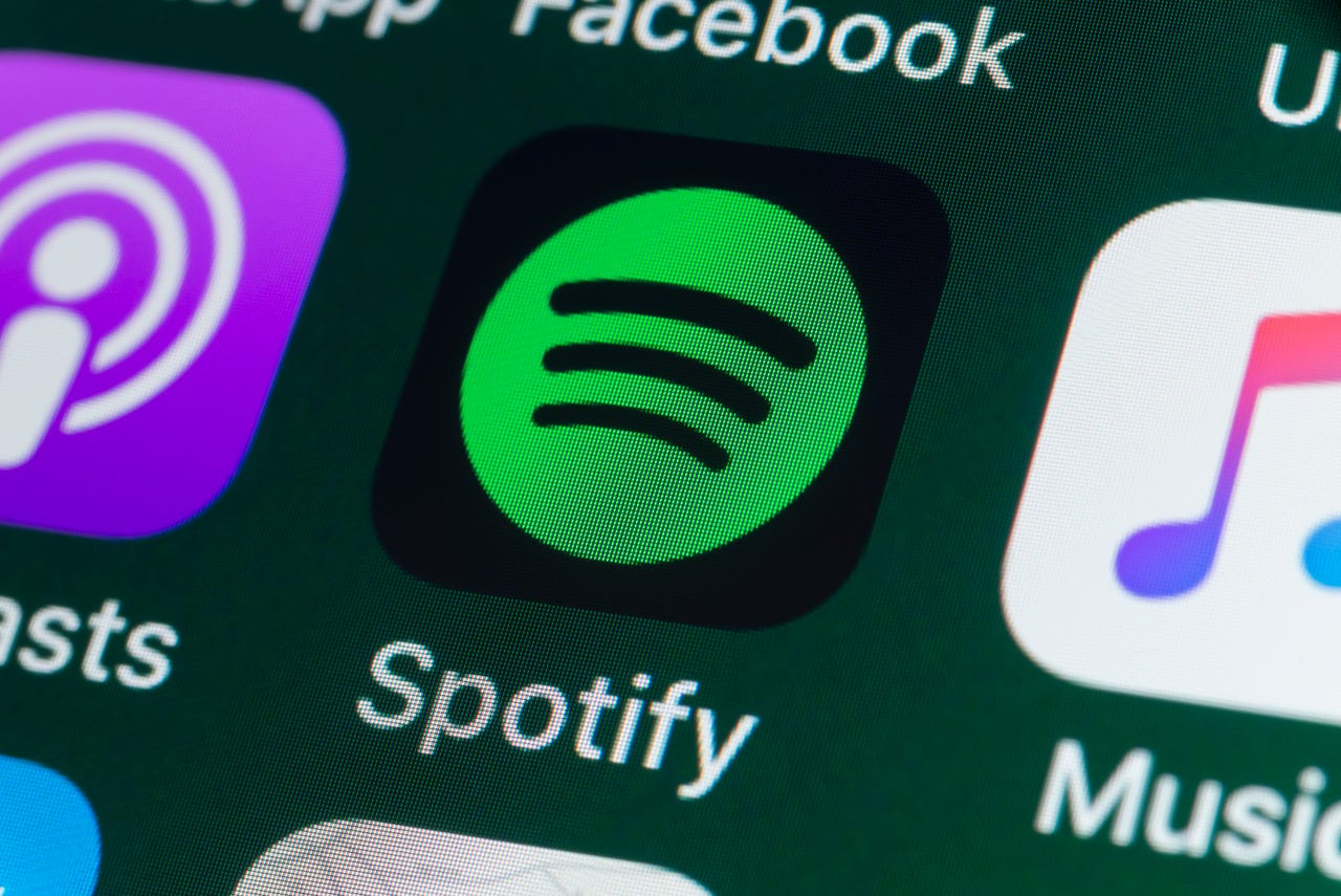 Spotify and Apple Music apps on a phone
