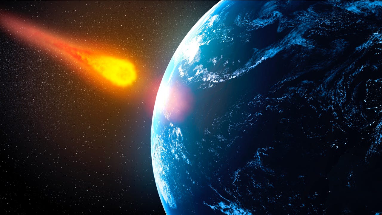asteroid depicted by a bright orange streak  hitting earth