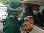 Grab opens COVID drive-through vaccination centre in Indonesia
