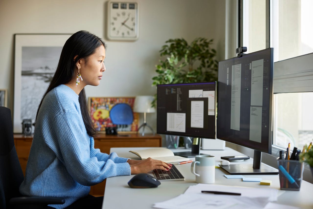 Woman using a desktop in office