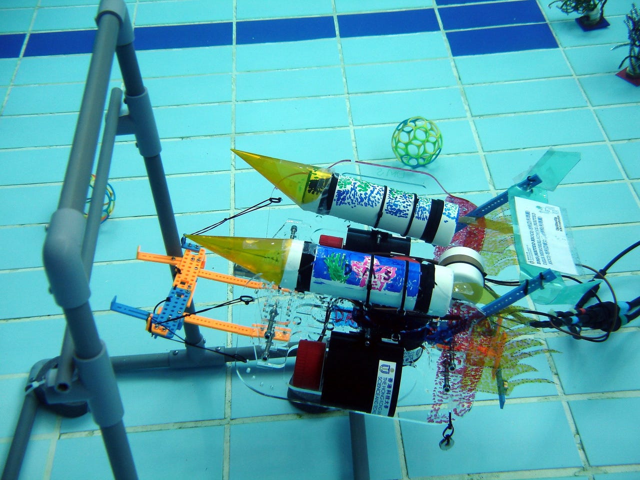 An underwater robot attempts to navigate an obstacle.