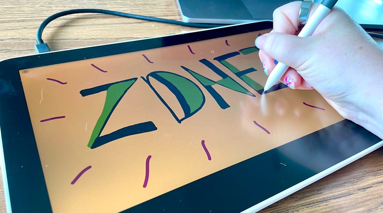 Close-up image of person's hand drawing on a drawing tablet