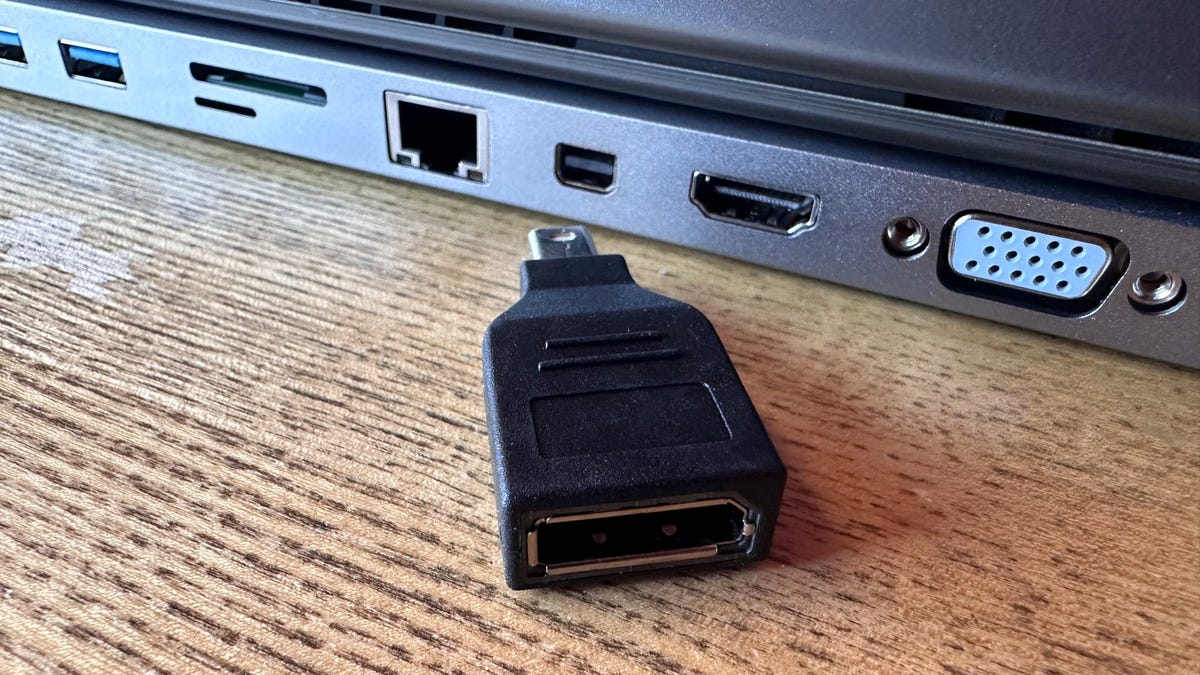 Adapter next to laptop ports