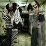 Two scary clown animatronics in a dingy hallway