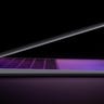 Macbook Air halfway open with a purple glow and a black background