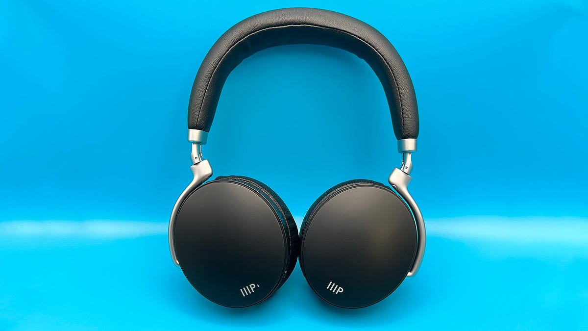 Monoprice SYNC-ANC headphones on a light blue background.