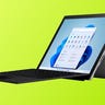 Microsoft Surface Pro 7+ tablet with attached keyboard against a lime green background
