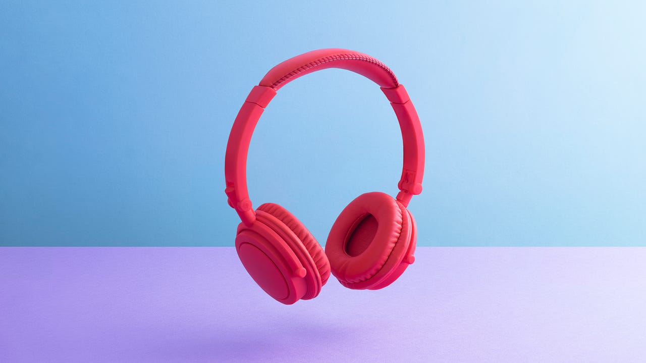Red headphones against a blue and purple background
