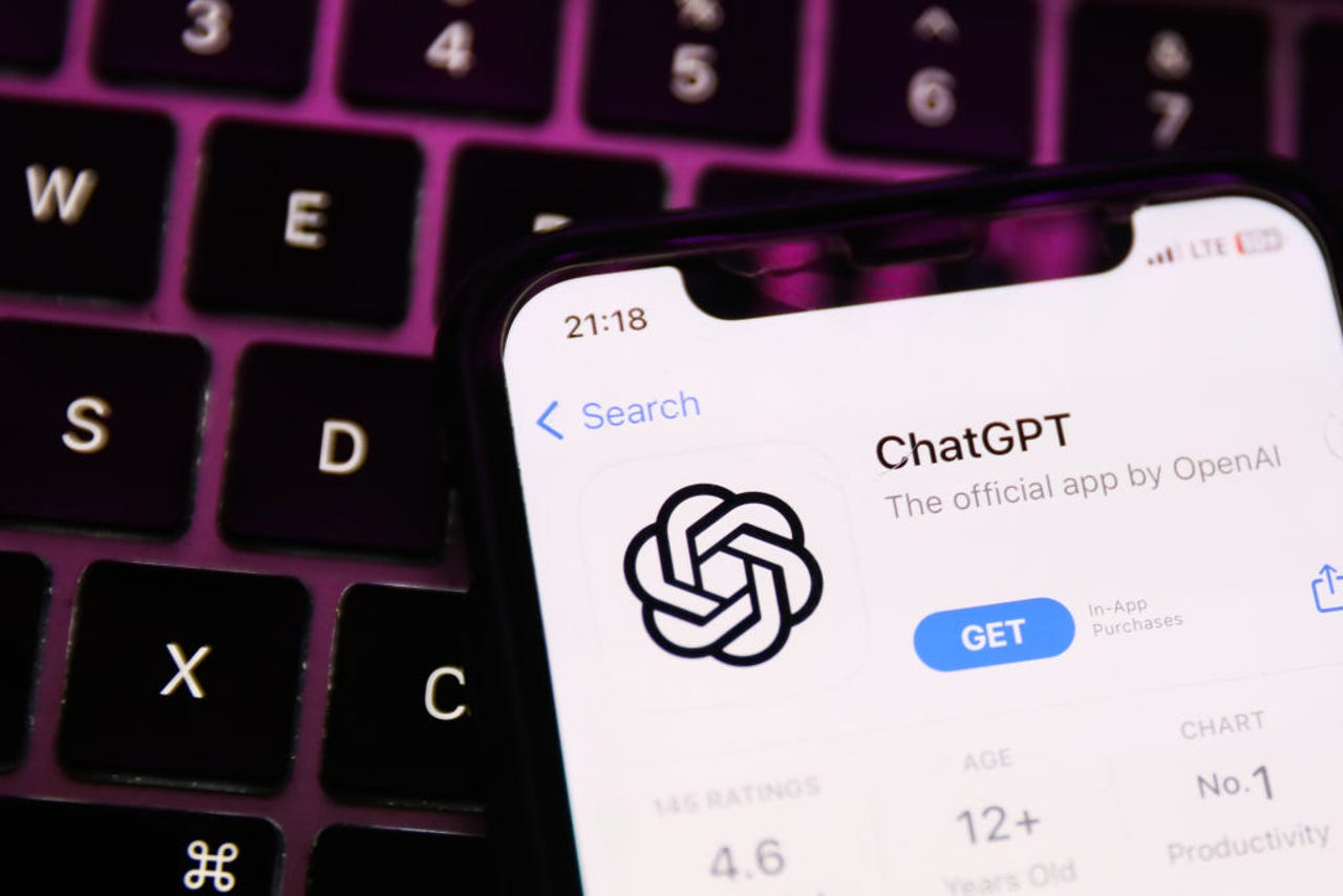 ChatGPT logo on a phone resting on a keyboard