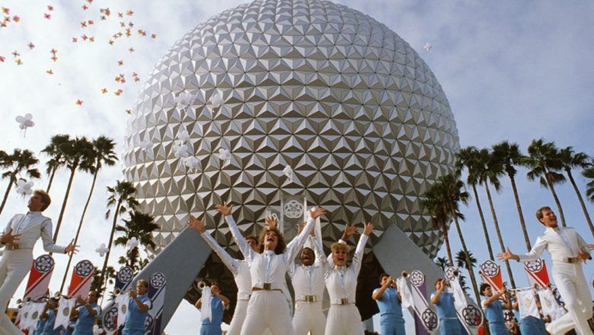 People celebrate in front of Epcot.