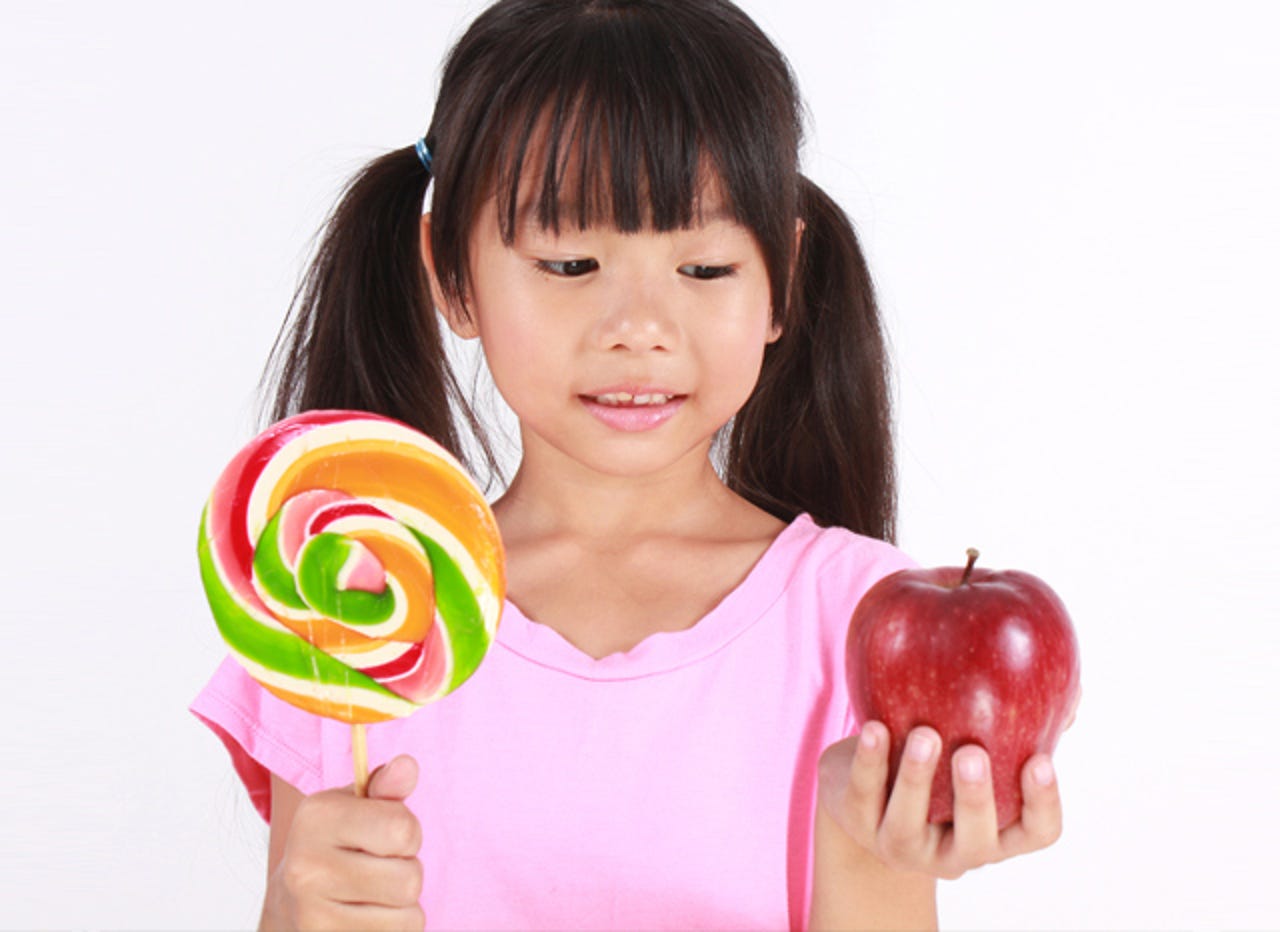 girl-with-lollipop-and-apple-thumb.jpg