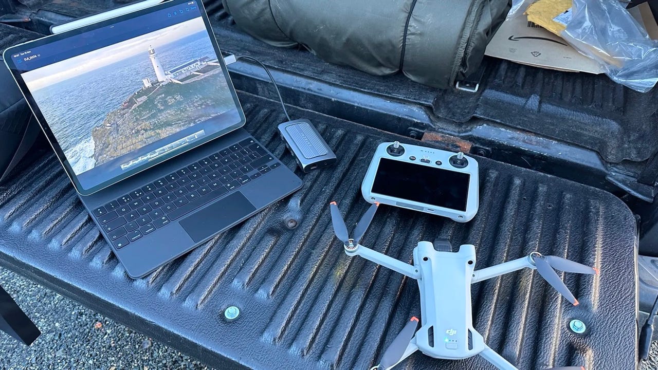 Apple iPad Pro tablet and DJI Mini 3 Pro drone next to each other