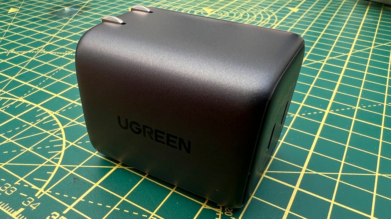 Ugreen Nexode 45W Dual USB C charger on a patterned desk mat.