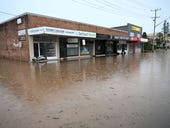 What is happening with telecommunications in flood-hit regions of Queensland and NSW