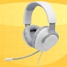 White JBL gaming headphones against a yellow background
