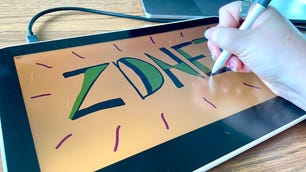 Close-up image of person's hand drawing on a drawing tablet