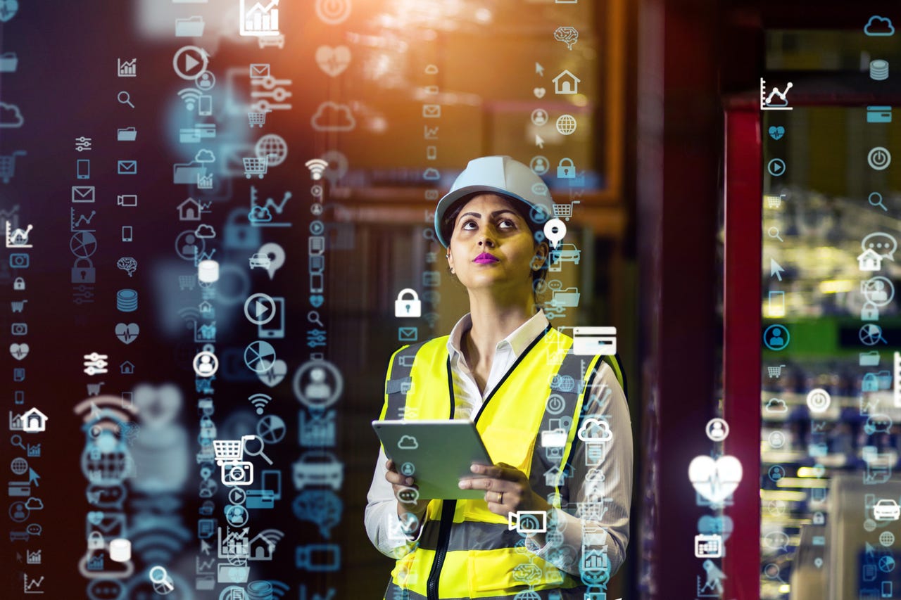 A supply chain worker surrounded by a visualization of data