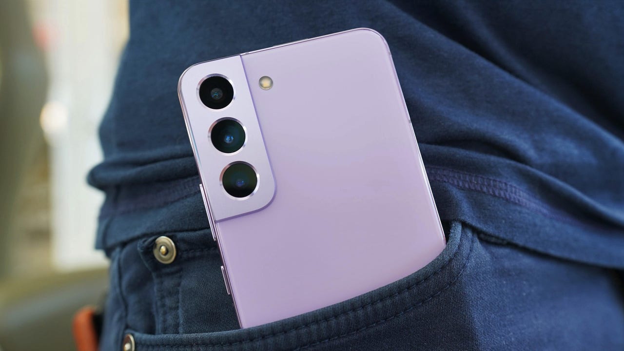 The Samsung Galaxy S22 in Bora Purple tucked into a pants pocket.