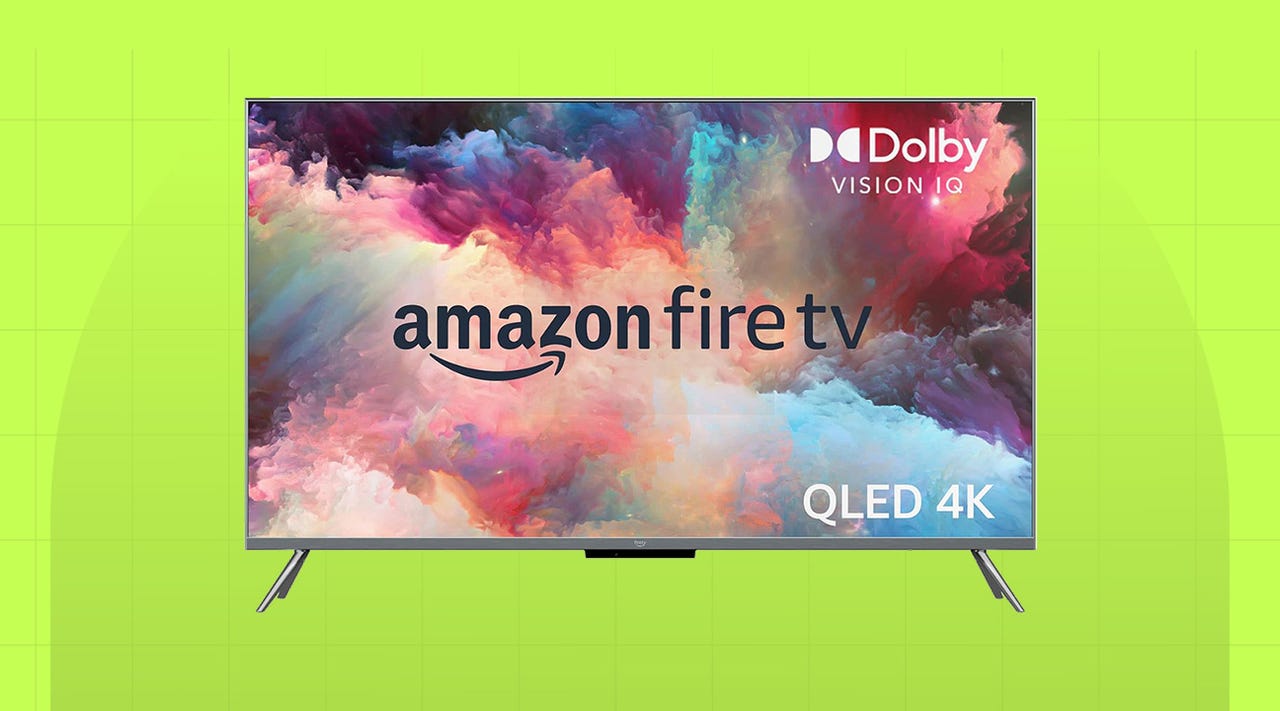 An Amazon Fire TV Omni QLED on a green background