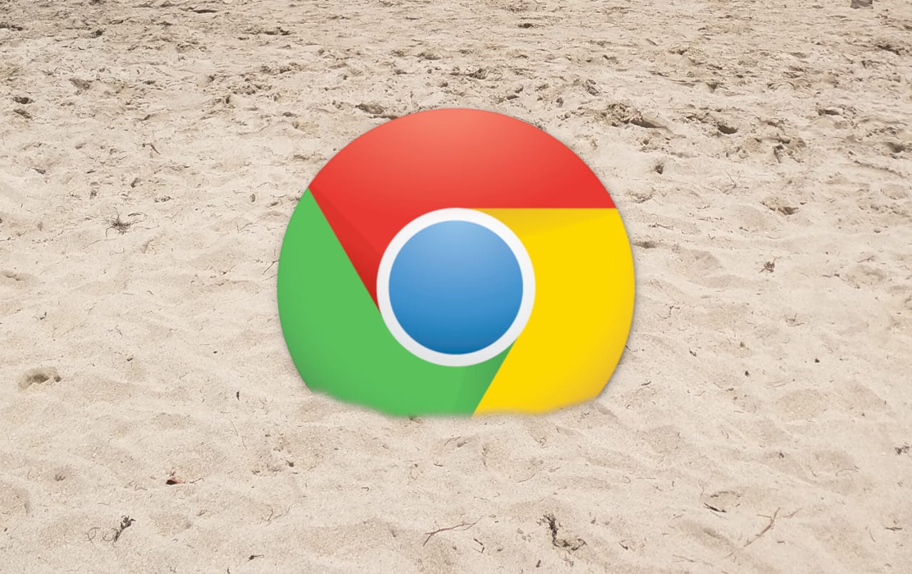 Chrome logo in sand.