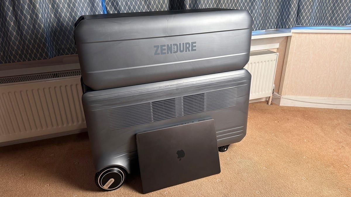 Zendure SuperBase V with satellite battery and MacBook Pro in front